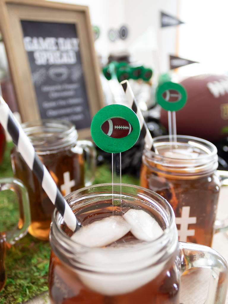 Green DIY drink stir stick with football stickers for party for a tailgate party or Super Bowl watch party