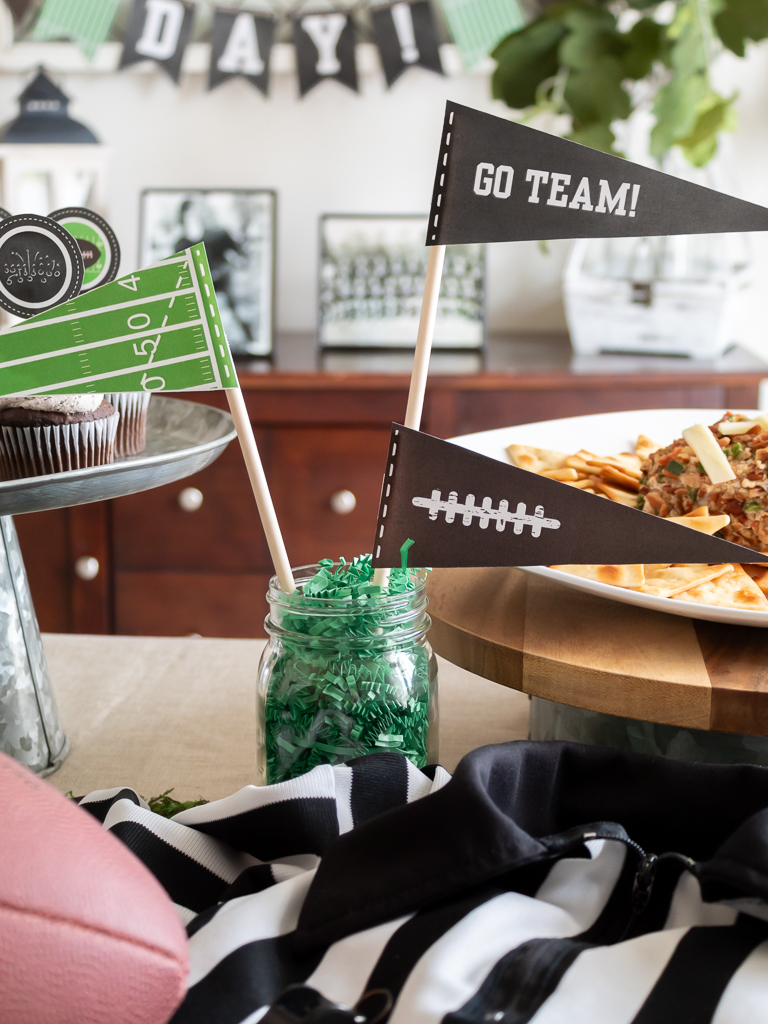 Free printable party pennants in a mason jar for a football party centerpiece