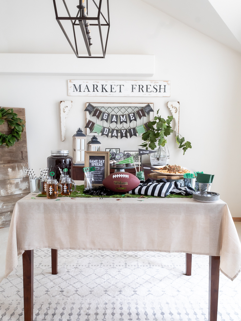 Dining Room styled with a game day banner and foot-ball themed party for the Big Game. 