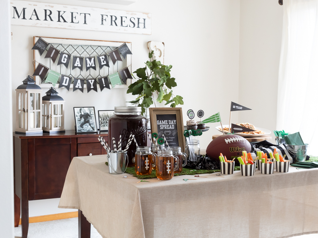 Dining Room styled with a free printable Super Bowl game day banner and foot-ball themed tablescape party with appetizers, a football cheese ball, and charcuterie cups withd dip for the Big Game.