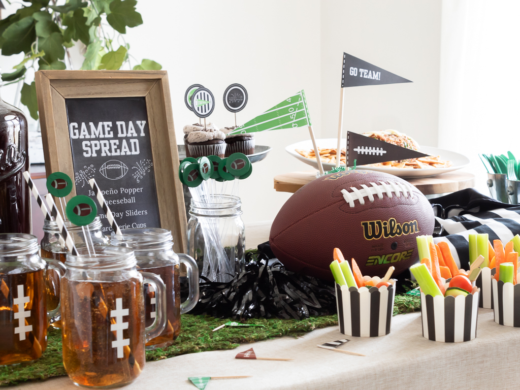 Drinks and appetizers styled on a foot-ball themed tablescape for a watch party for the Big Game