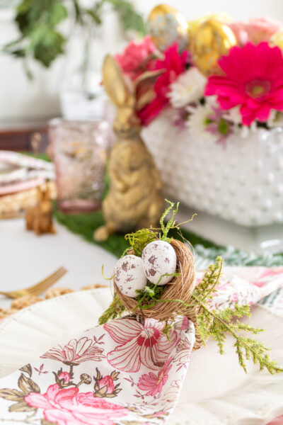 Close-up of DIY Easter Napkin Ring on Easter Brunch Table Paired with a Colorful Pink and Green Floral Napkin