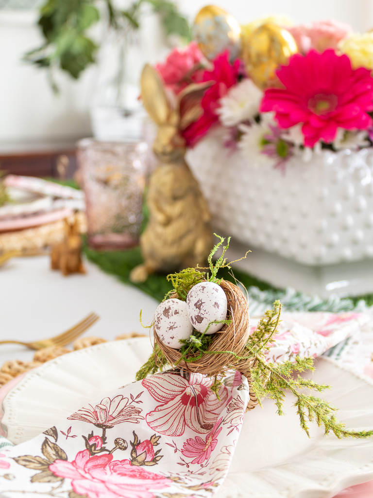 Close-up of DIY Easter Napkin Ring on Easter Brunch Table Paired with a Colorful Pink and Green Floral Napkin