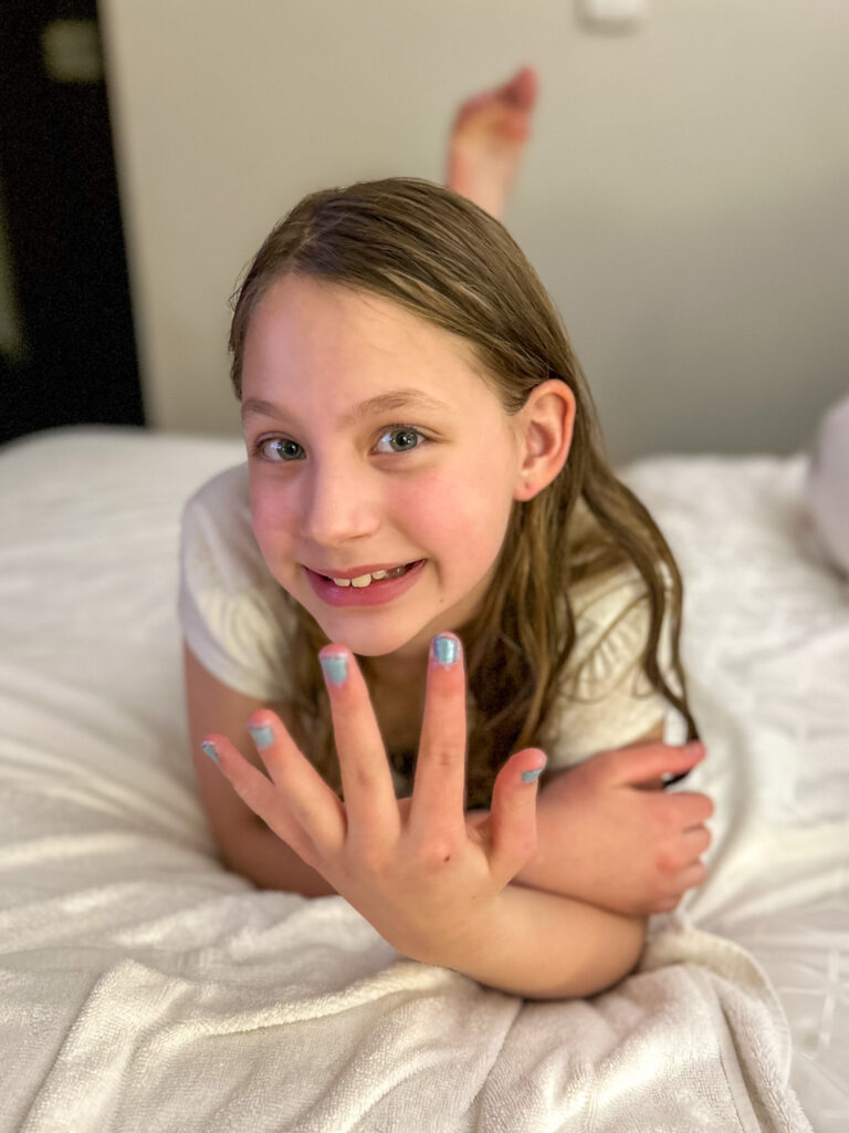 daughter showing off manicured nails for spa night at home