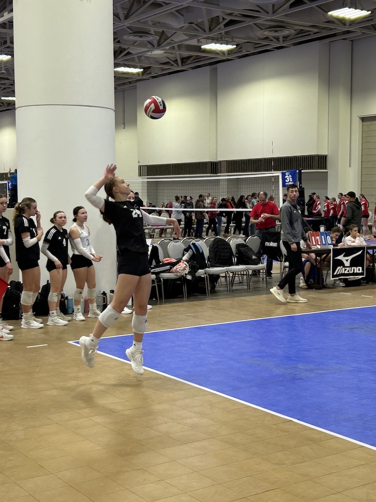 athlete serving the volleyball