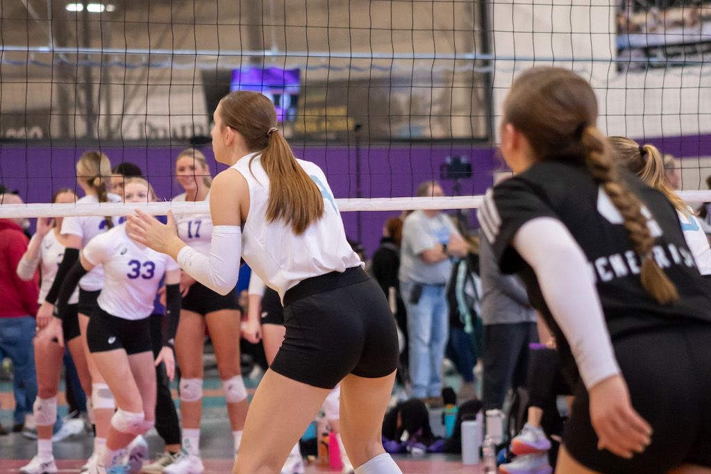 volleyball player at net ready to block