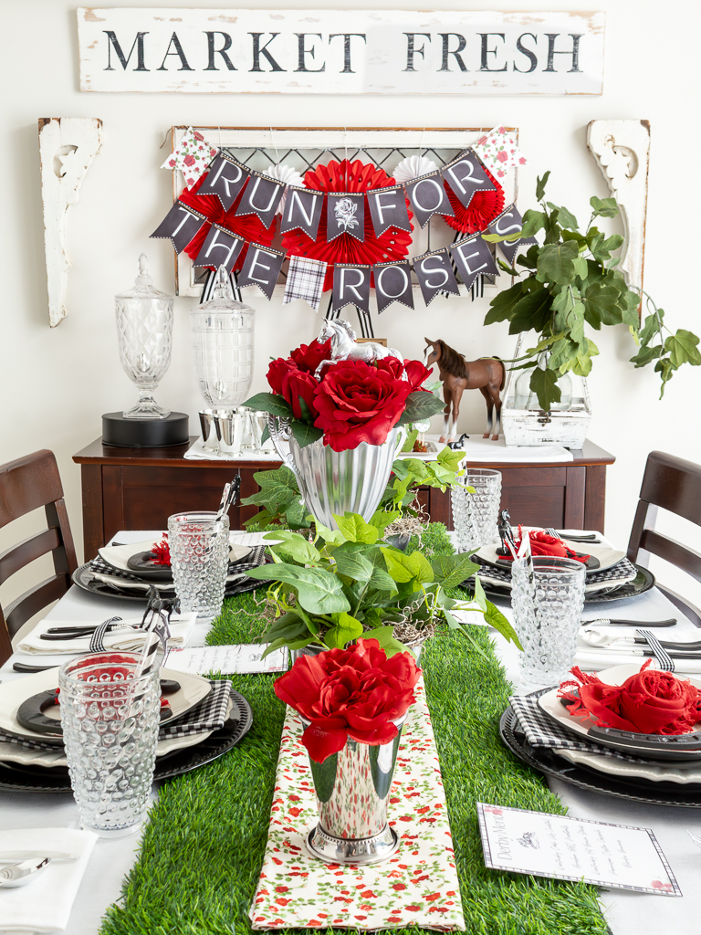 Dinining room decorated for a Kentucky Derby party with red and black derby decorations