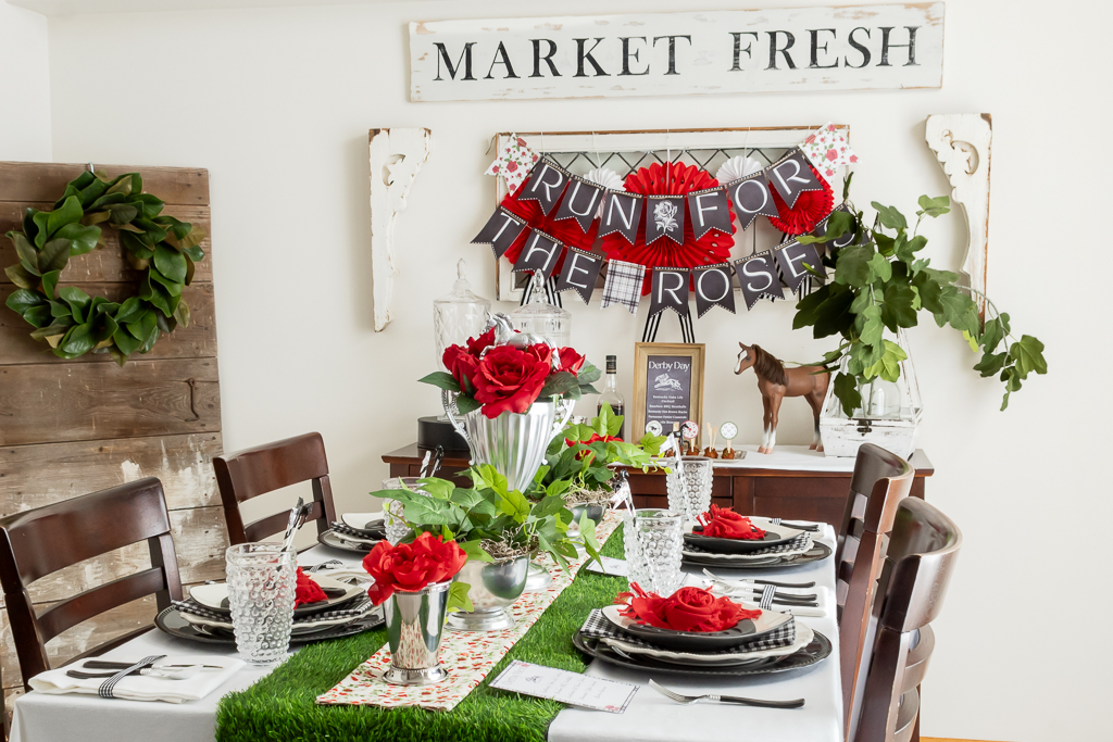 Dinining room decorated for a Kentucky Derby party with red and black derby decorations