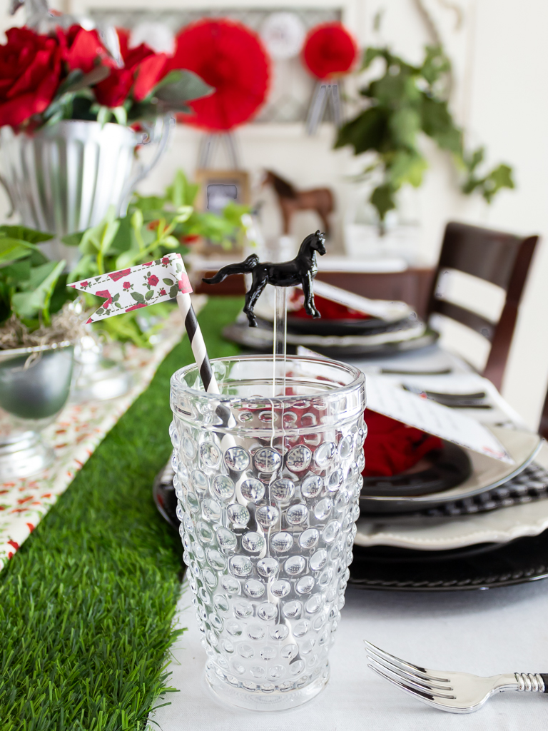 Hobnail drinking glasses on a Kentucky Derby tablescape with straws and DIY horse stir sticks