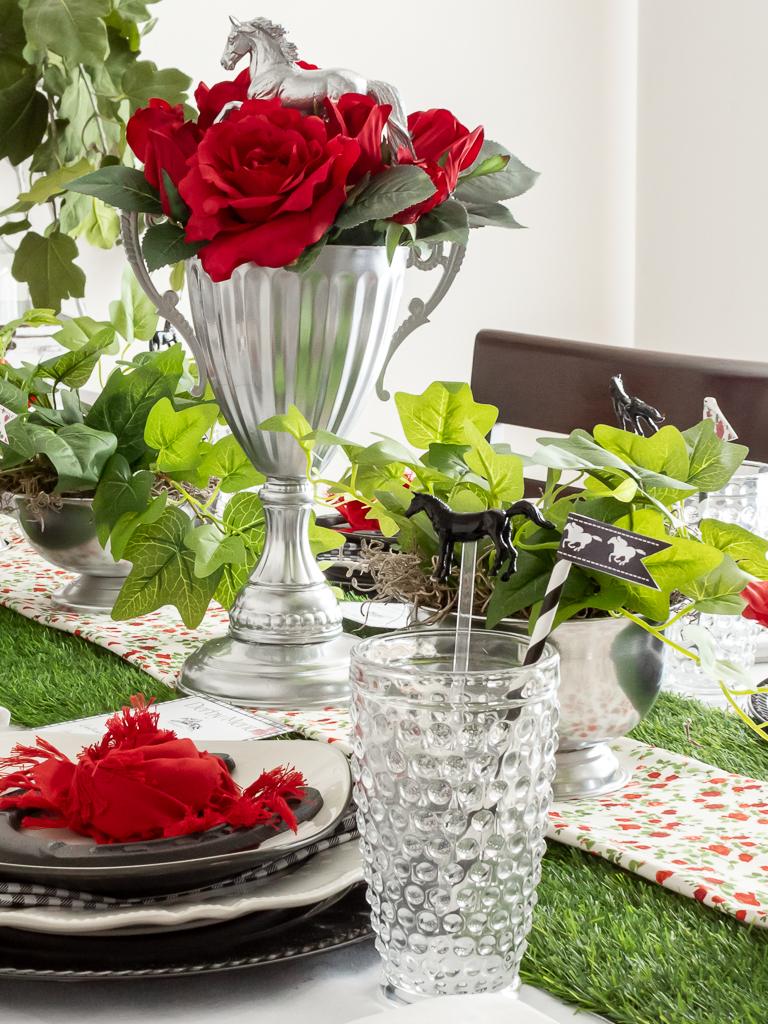 Red and black tablescape styled for a horse racing-themed Derby party