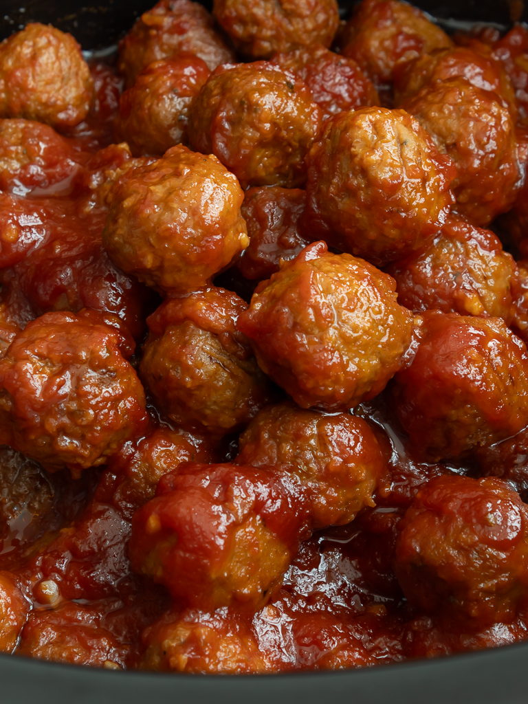 Close up view of Crockpot Bourbon BBQ Meatballs in the slow cooker 