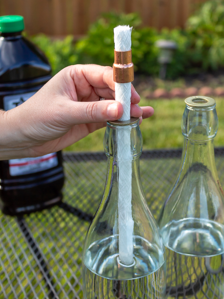 Assembling the DIY wine bottle tabletop torches