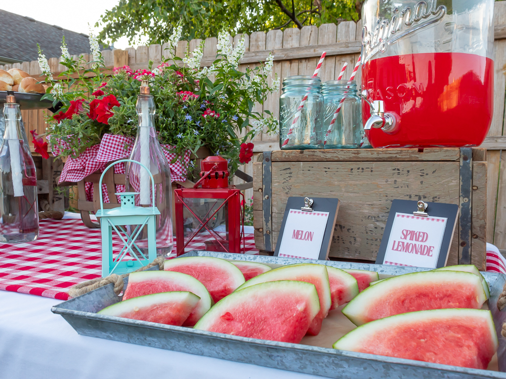 Sliced watermelon on a galvanized metal serving tray for a summer party