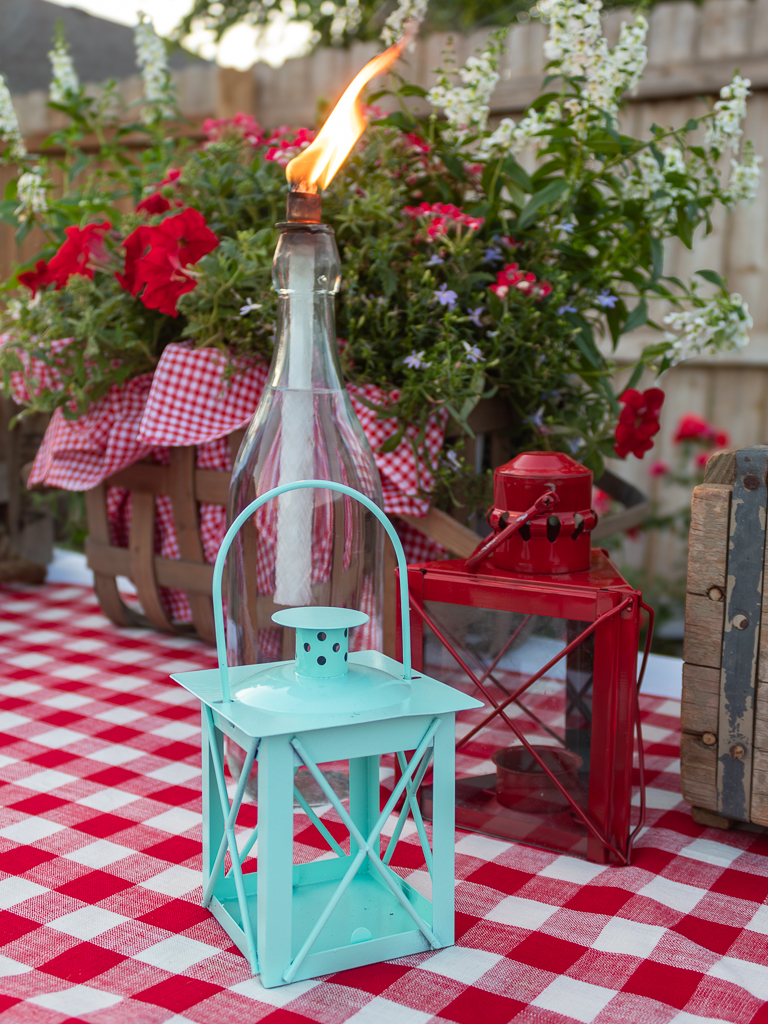 Close-up view of DIY glass bottle citronella tiki torch