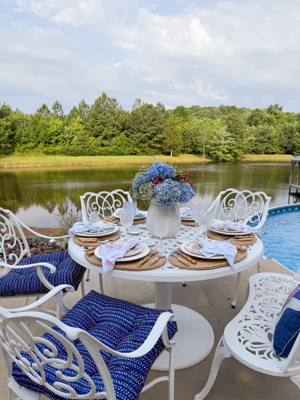 Red, white and blue cookout table by the lake from The Ponds Farmhosue