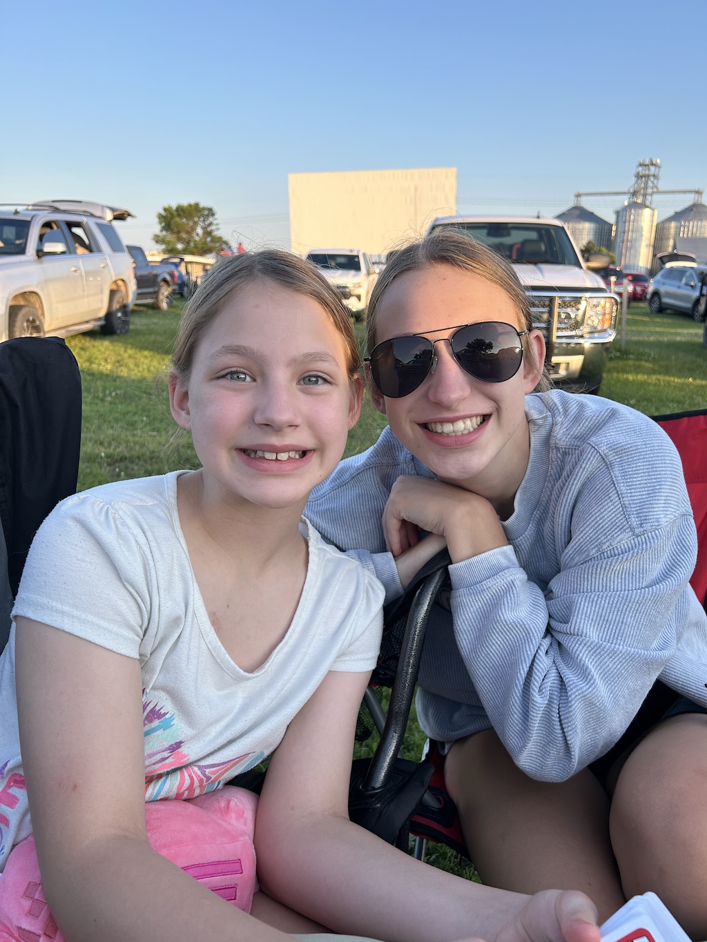 Kids smiling at the drive-in-movie