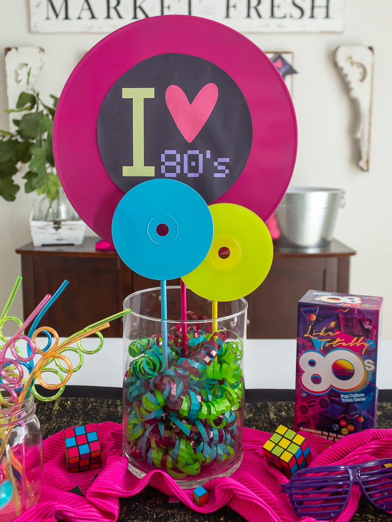 DIY neon 80s party centerpiece made with records and CDs