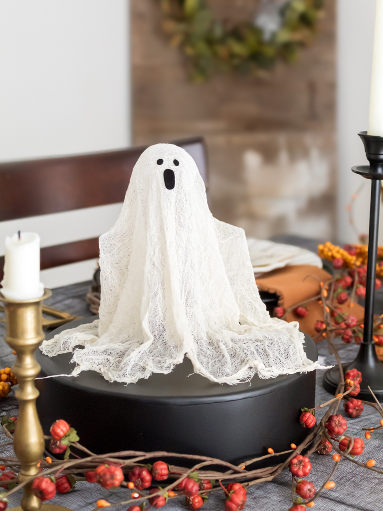 Small DIY ghost on pedestal displayed on a table