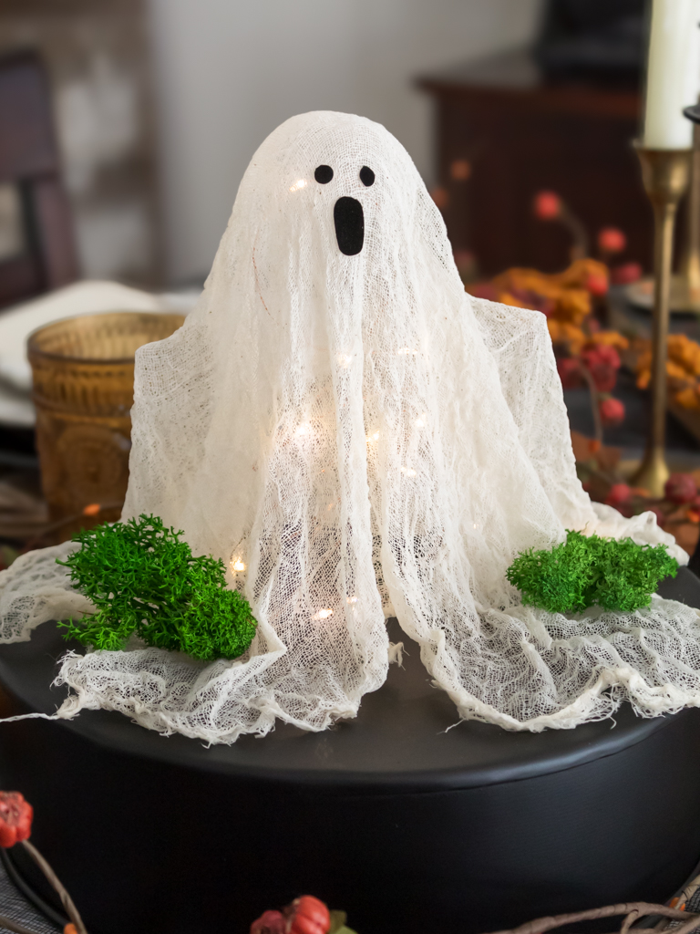 DIY cheesecloth ghost with fairylights underneath