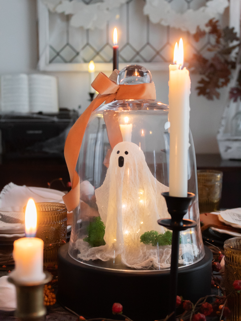 DIY cheese cloth ghost under a cloche Pottery Barn Dupe displayed on a Halloween tablescape