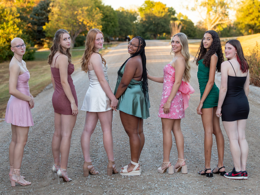 Peyton Junior year Homecoming with volleyball teammates posing for photos