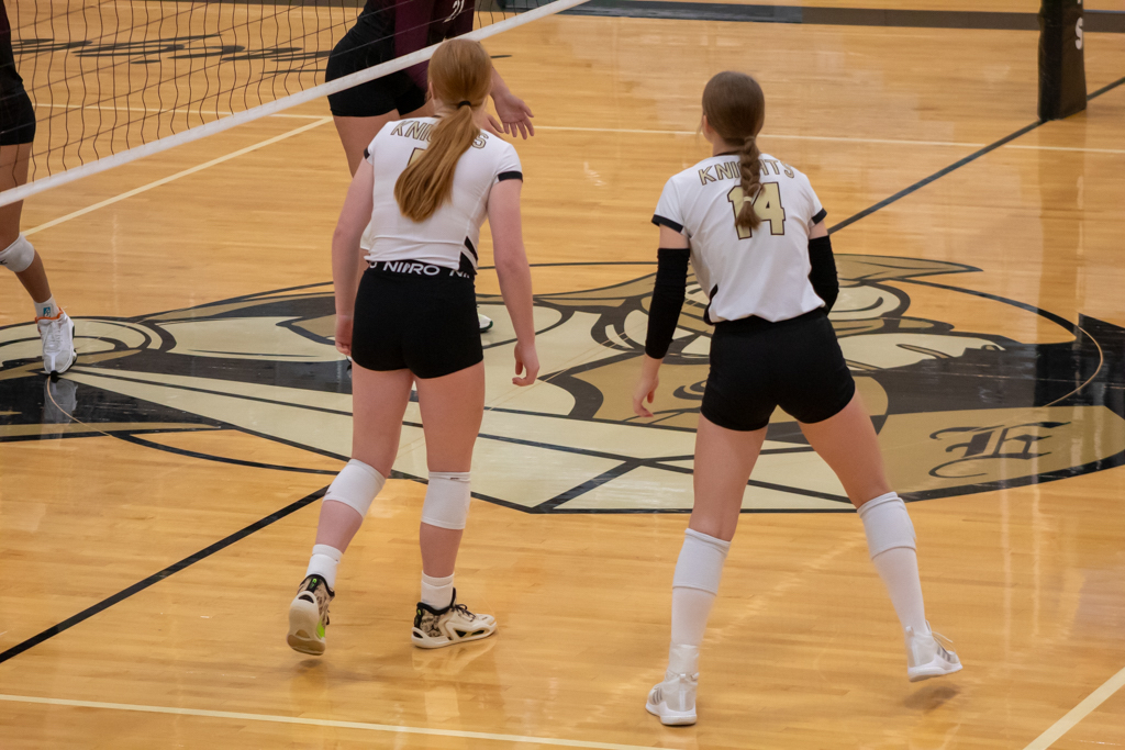 Volleyball players on the court waiting for an attack from their opponent