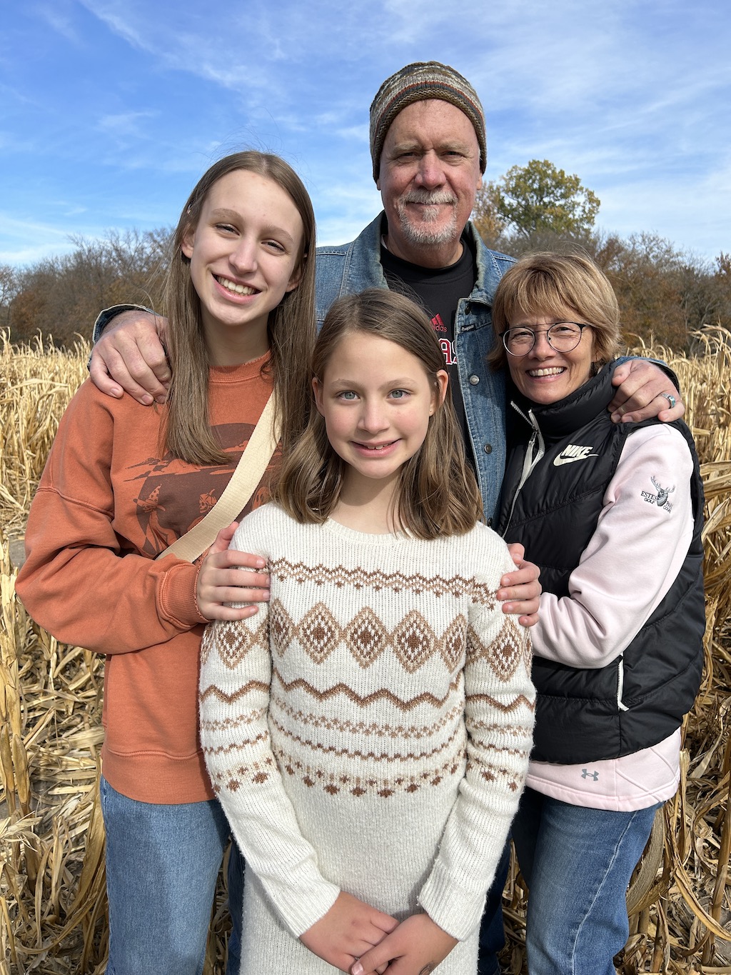 Grandparents posing with grandchildren at the pumpkin patch