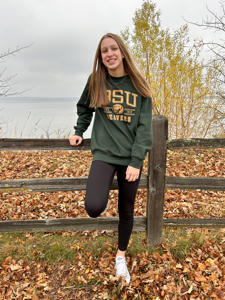 girl standing in front of lake Bemidji wearing a BSU sweatshirt