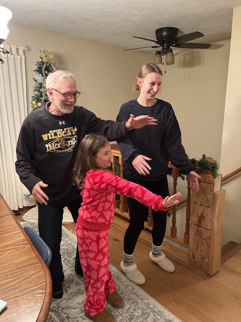 Grandkids teaching grandpa a TikTok dance