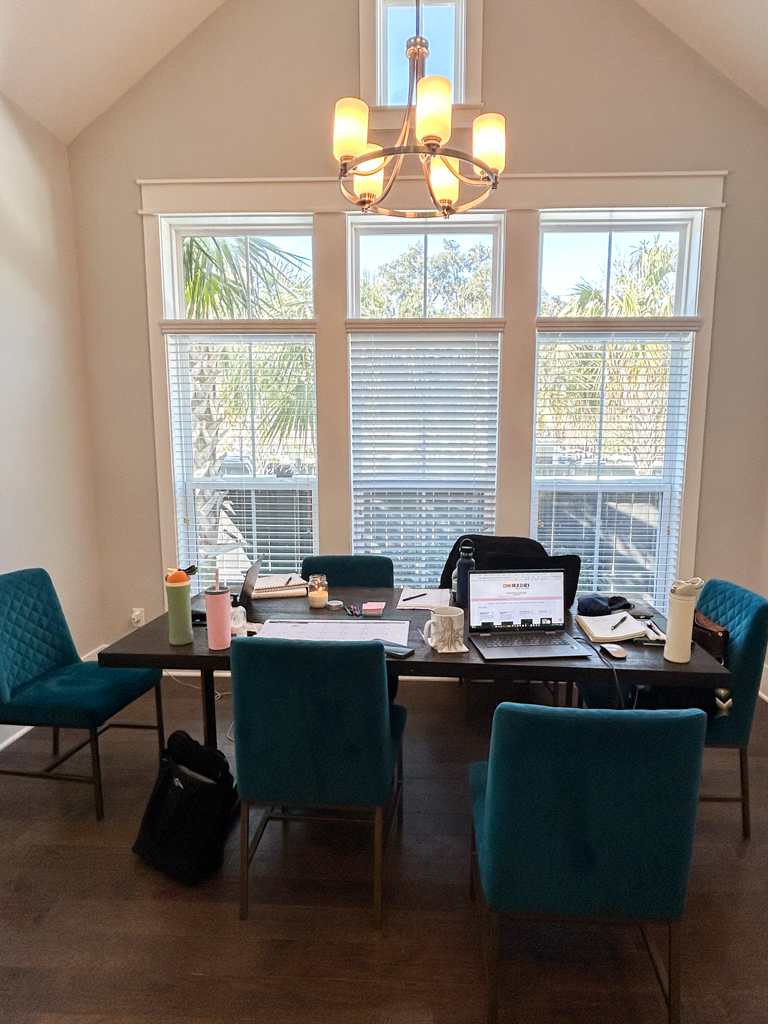 Dining room table and chairs in airbnb used a an office area for a work retreat