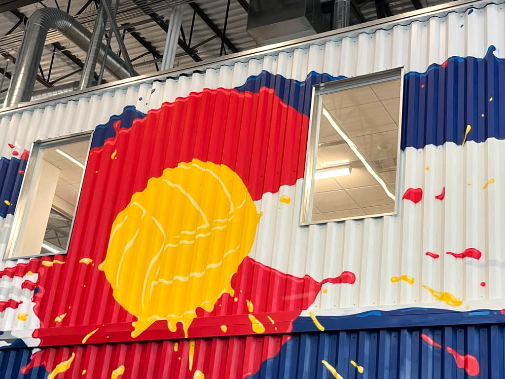 Colorado logo with a volleyball painted on the side of a wall